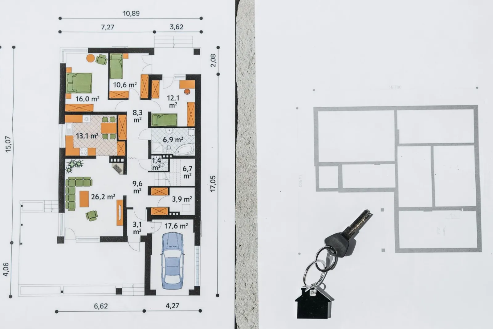 A comprehensive floor plan layout featuring a house key symbolizing real estate and homeownership.